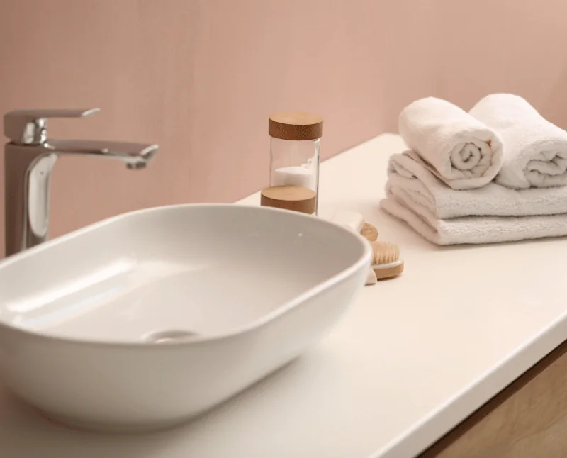 Towels and skincare essentials for spray tan prep and aftercare